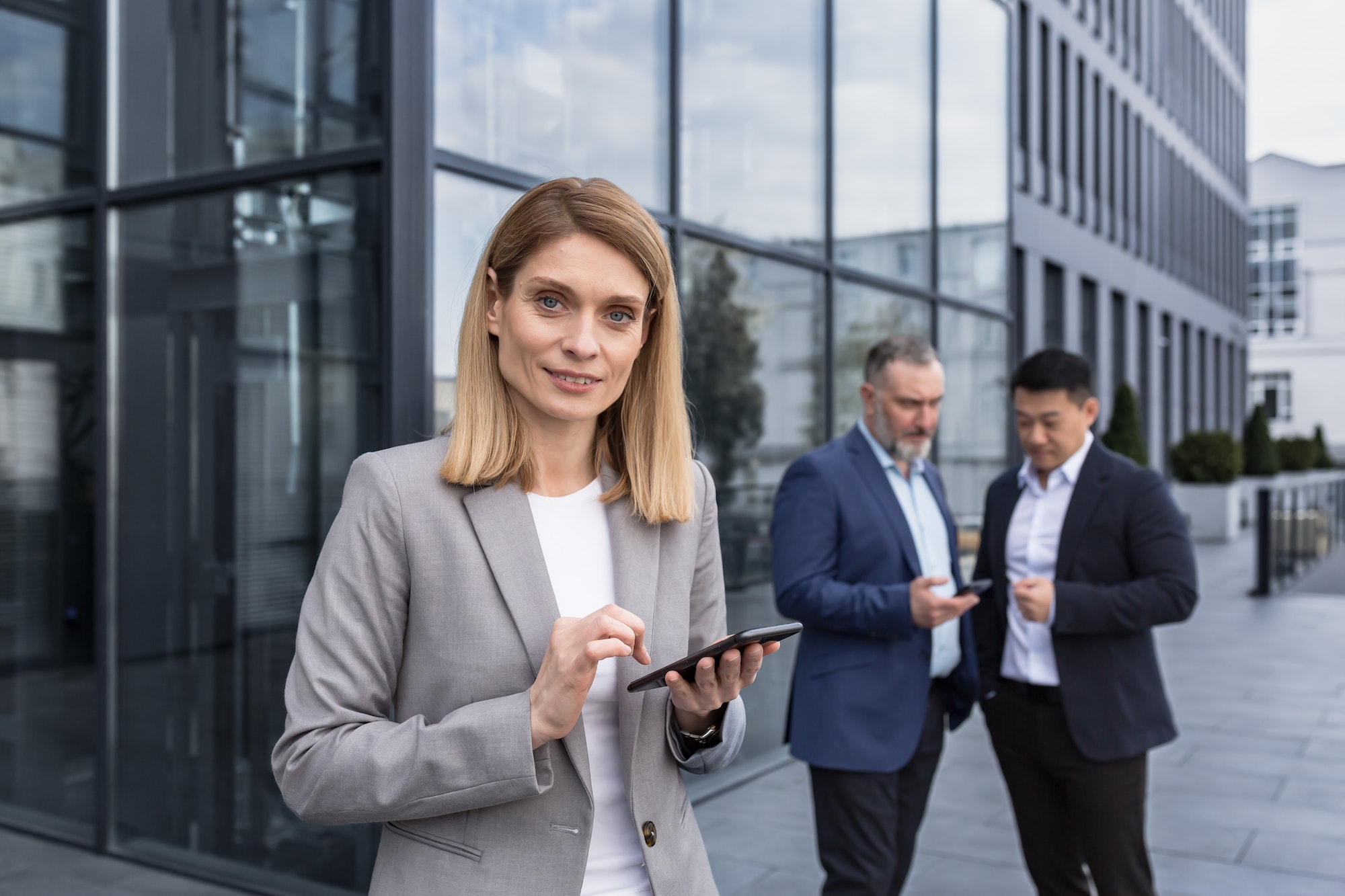 Portrait of successful senior woman businessman and specialist, program manager with tablet computer